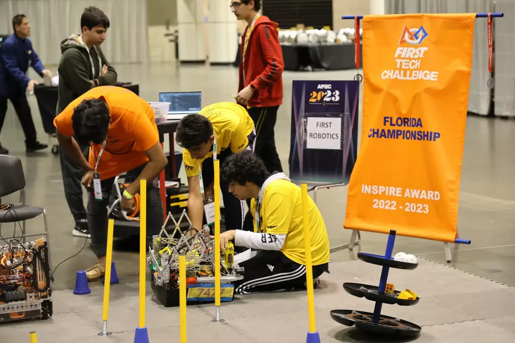 FIRST Robotics Team Preparing A Robot For A Demonstration